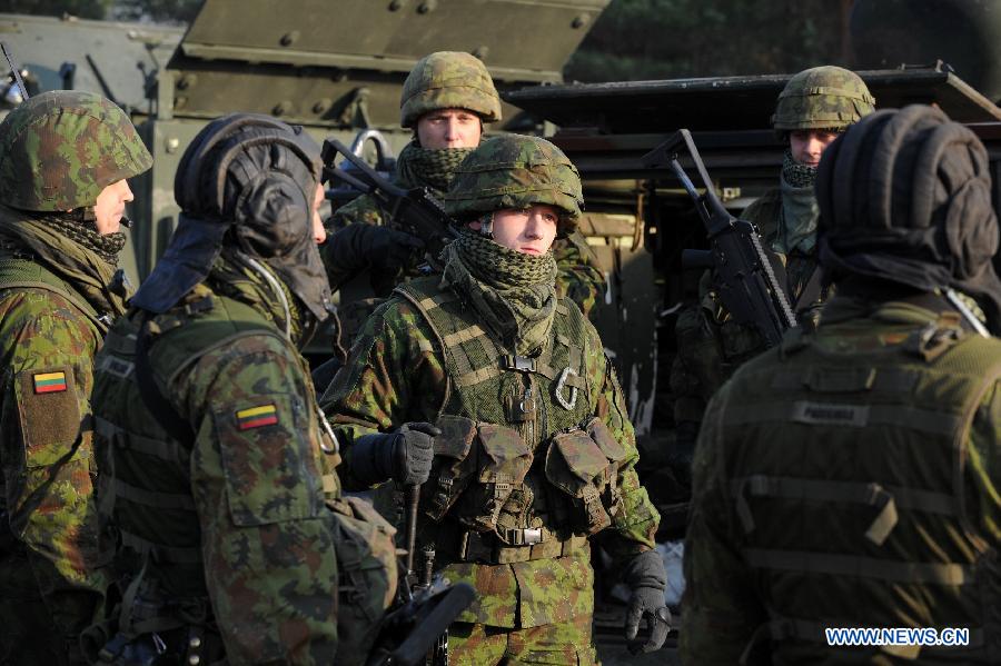 Lithuanian soldiers take part in the military exercise in Pabrade, Lithuania on Oct. 30, 2014. Lithuanian and US soldiers participated a infantry fighting vehicles live-fire exercise here on Thursday.