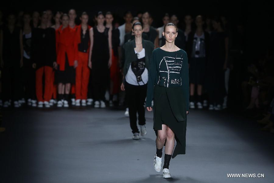 Models present creations of the winter collection of 'Uma Raquel Davidowicz' 2015 during the 38th Sao Paulo Fashion Week (SPFW), in Sao Paulo, Brazil, on Nov. 3, 2014.