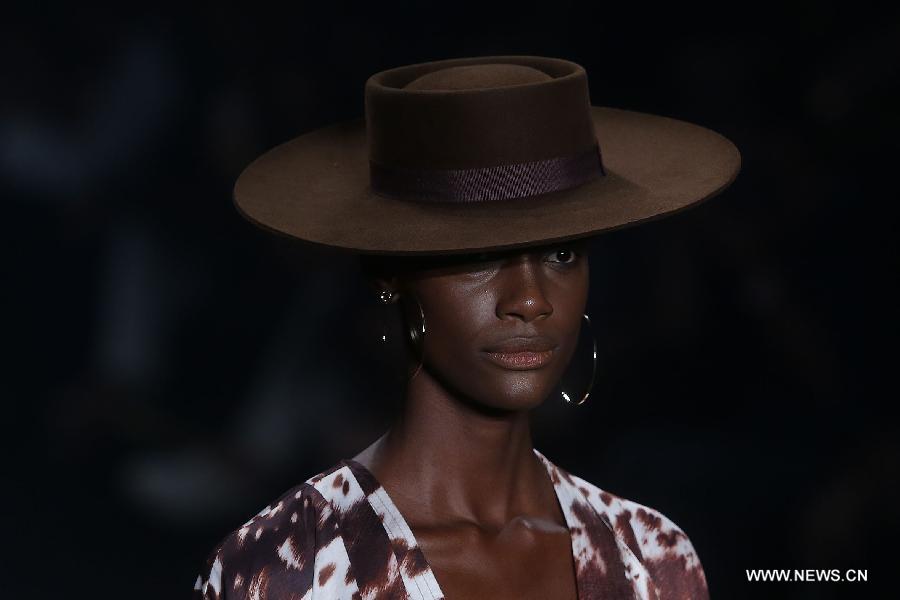 A model presents a creation of the winter collection of 'Victor Dzenk' 2015 during the 38th Sao Paulo Fashion Week (SPFW), in Sao Paulo, Brazil, on Nov. 3, 2014.