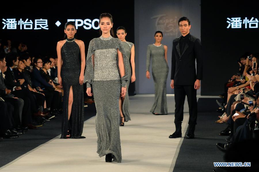 Models present creations designed by Gioia Pan in Taipei, southeast China, Nov. 6, 2014. 