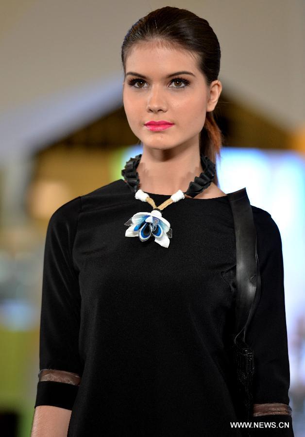 A model presents a creation by Indonesian designer carla handayani during the Jakarta Fashion Week 2015, in Jakarta, Indonesia, Nov. 7, 2014. The event runs from Nov. 1 to Nov. 7. 