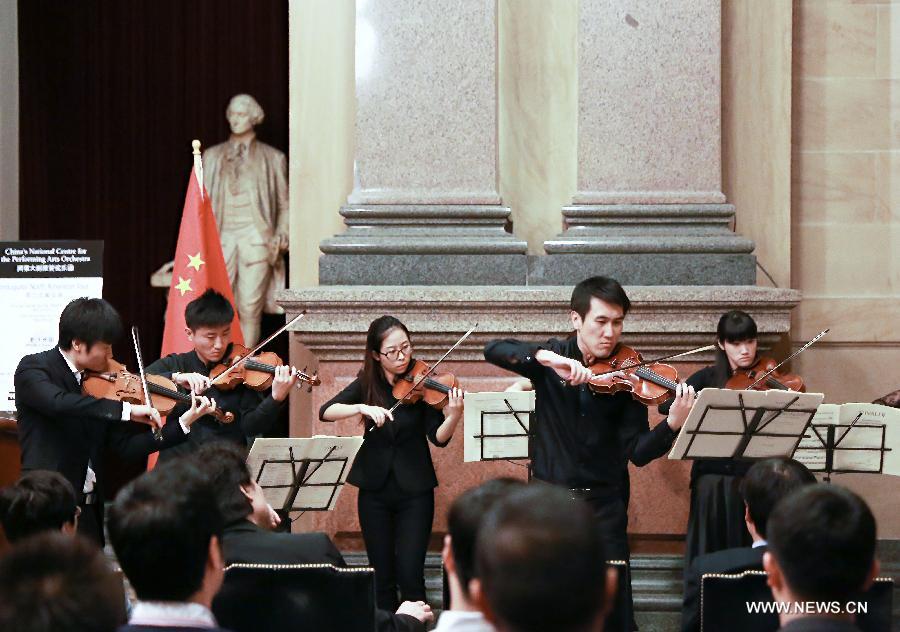 Musicians with the China National Centre for the Performing Arts Orchestra perform a string quartet at the City Hall in Philadelphia, the United States, on Nov. 6, 2014. 