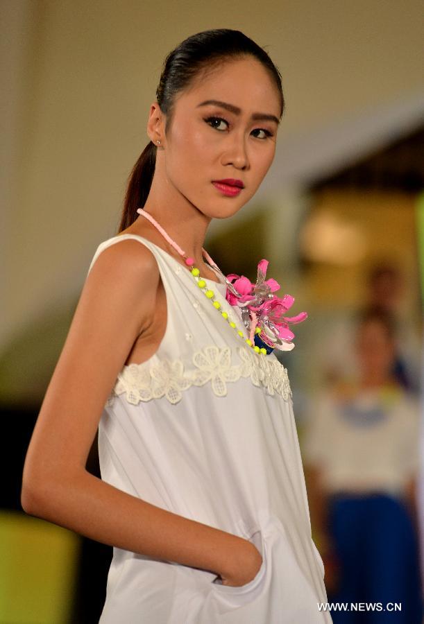 A model presents a creation by Indonesian designer Lenny Agustin during the Jakarta Fashion Week 2015, in Jakarta, Indonesia, Nov. 7, 2014. The event runs from Nov. 1 to Nov. 7. 