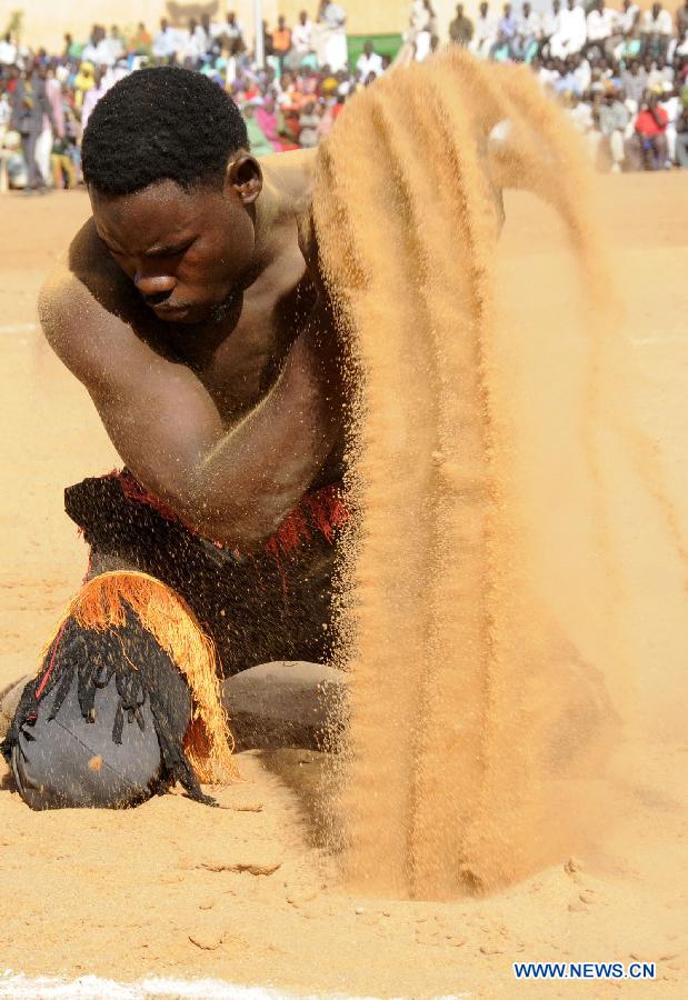 A Nubian man prepares for a wrestle competition during the annual harvest festival in Omdurman, Sudan, Nov. 8, 2014.