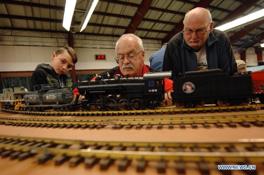 Exhibitors prepare model trains to run during the 32nd Model Railway Exhibition 'Trains 2014' in Burnaby, Canada, Nov. 8, 2014.