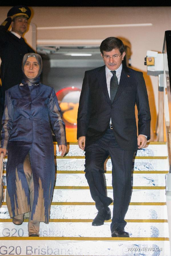 Turkish Prime Minister Ahmet Davutoglu (R) arrives in Brisbane of Australia to attend the G20 summit on Nov. 14, 2014.