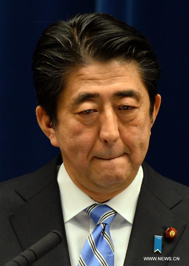 Japanese Prime Minister Shinzo Abe addresses a press conference in Tokyo, Japan, Nov. 18, 2014. 