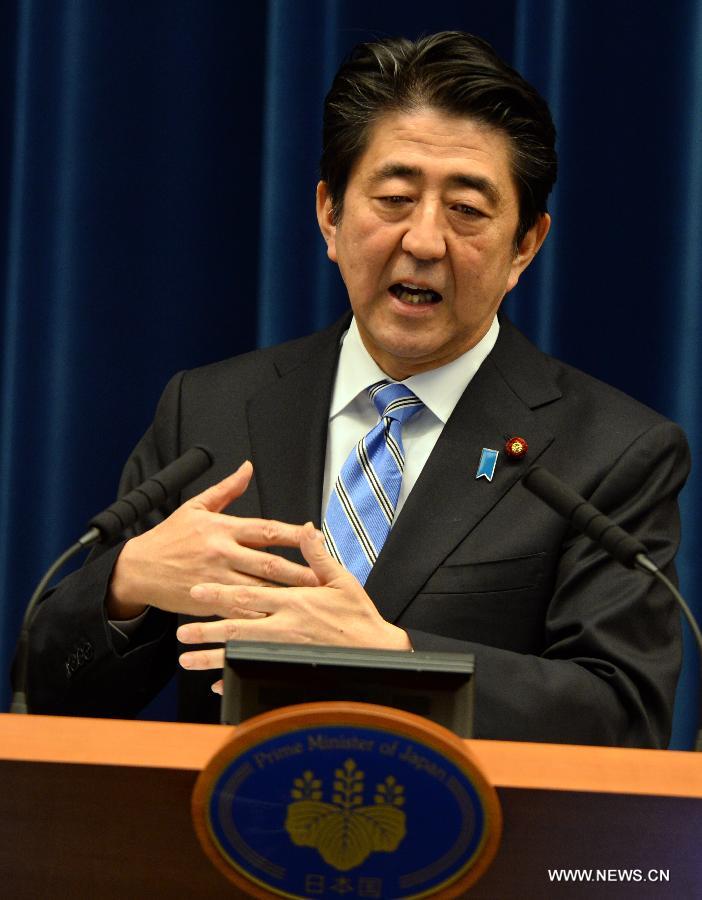 Japanese Prime Minister Shinzo Abe addresses a press conference in Tokyo, Japan, Nov. 18, 2014. 