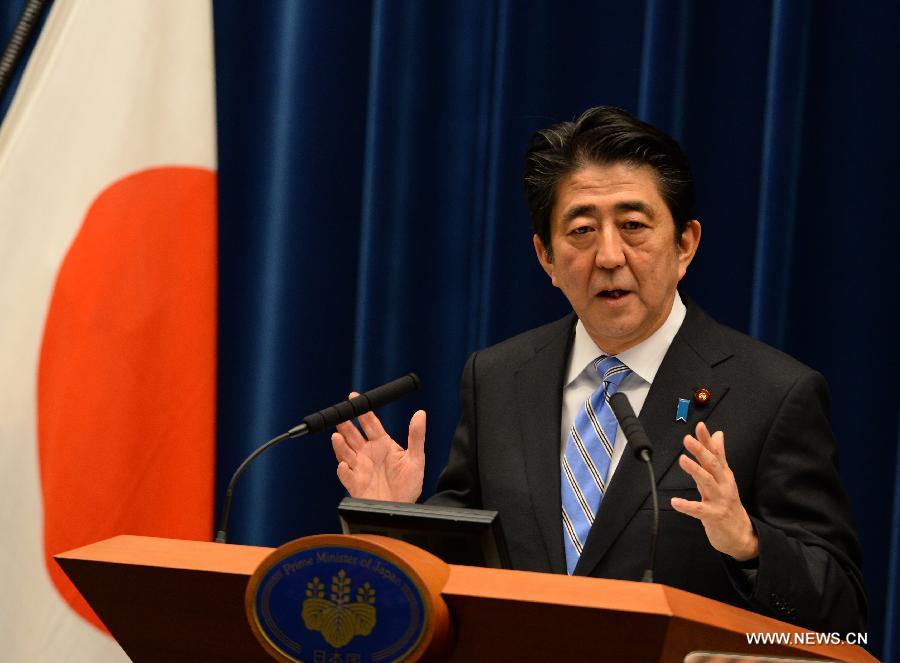 Japanese Prime Minister Shinzo Abe addresses a press conference in Tokyo, Japan, Nov. 18, 2014.