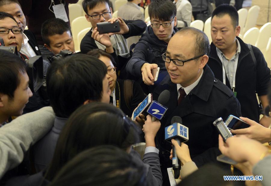 Pan Shiyi, chairman of real estate developer SOHO China, receives interview at the closing ceremony of the World Internet Conference in Wuzhen, east China's Zhejiang Province, Nov. 21, 2014.