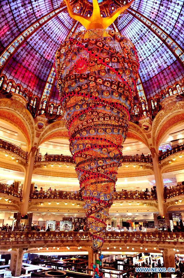 A 25-meter-high Christmas tree is seen inside a shopping mall in Paris, France, on Nov. 27, 2014. 