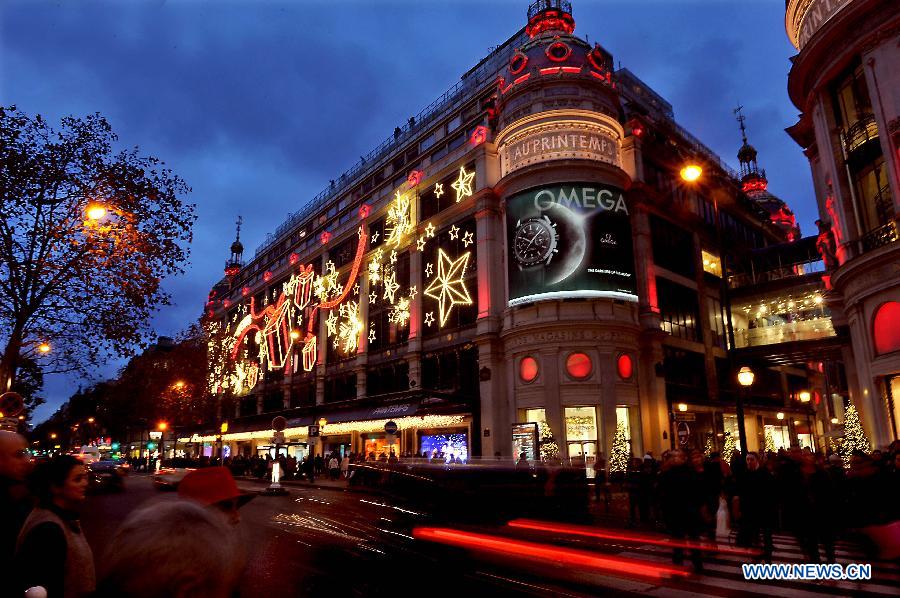 Christmas lights decorate the facades of a shopping mall in Paris, France, on Nov. 27, 2014. 