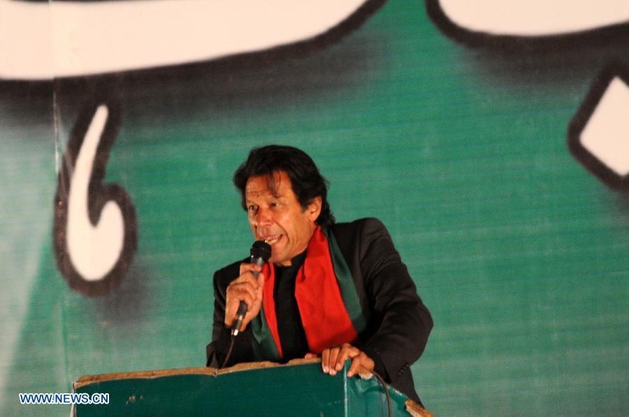 Imran Khan, leader of Pakistan Tehrik-e-Insaf (PTI) or Justice Movement Party, addresses his supporters during an anti-government rally in front of the Parliament in Islamabad, capital of Pakistan, on Nov. 30, 2014. Pakistan's influential political leader Imran Khan on Sunday gave a country's shutdown call on December 16 as part of his anti-government protest plan. (Xinhua/Ahmad Kamal) 