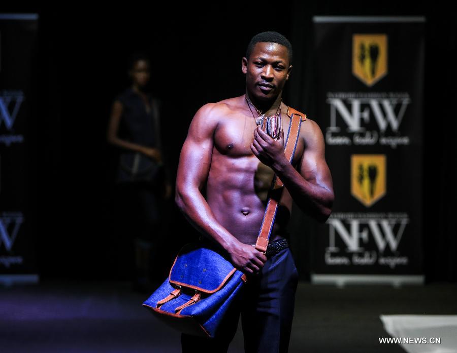 A model presents a fashion creation of designer Leather Freak during the 2014 Nairobi Fashion Week in Nairobi, capital of Kenya, Nov. 30, 2014.