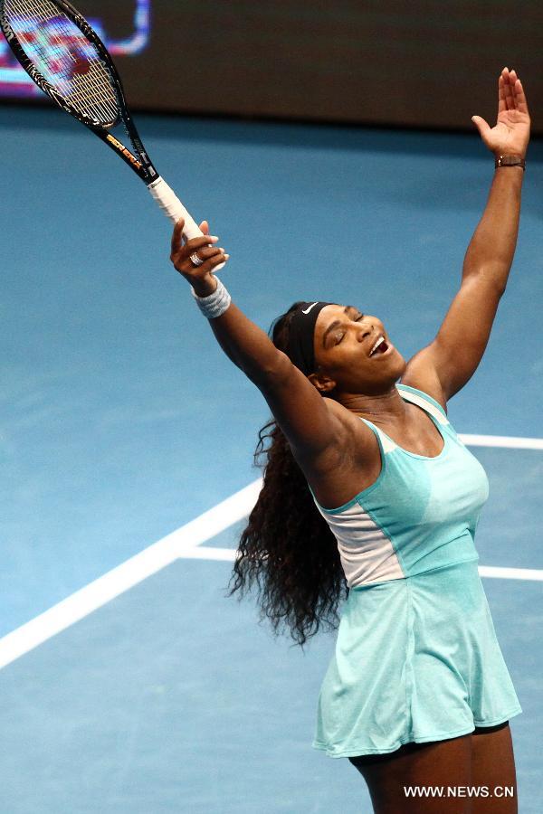 DBS Singapore Slammers player Serena Williams of the United States celebrates after the women's singles match against Manila Mavericks player Kirsten Flipkens of Belgium in the International Premier Tennis League in Pasay City, the Philippines, on Nov. 30. 2014. 