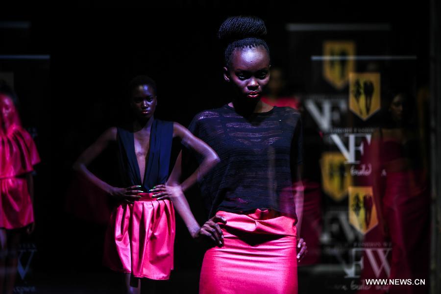 The multiple exposure photo taken on Nov. 30, 2014 shows models presenting fashion creations of DYC Inc. during the 2014 Nairobi Fashion Week in Nairobi, capital of Kenya. 