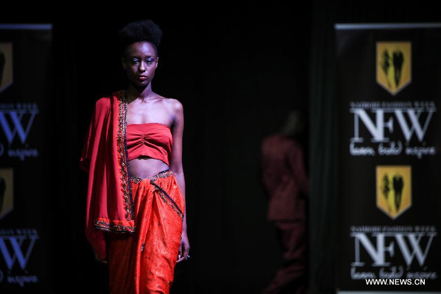 A model presents a fashion creation of designer Jo Meja during the 2014 Nairobi Fashion Week in Nairobi, capital of Kenya, Nov. 30, 2014. 