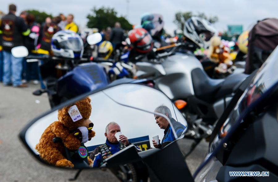 The event, which has 32 years history, attracted nearly 15,000 motorcyclists to take part in this year. More than 25,000 toys and stationary items have been donated by the motorcycle enthusiasts and the crowds.