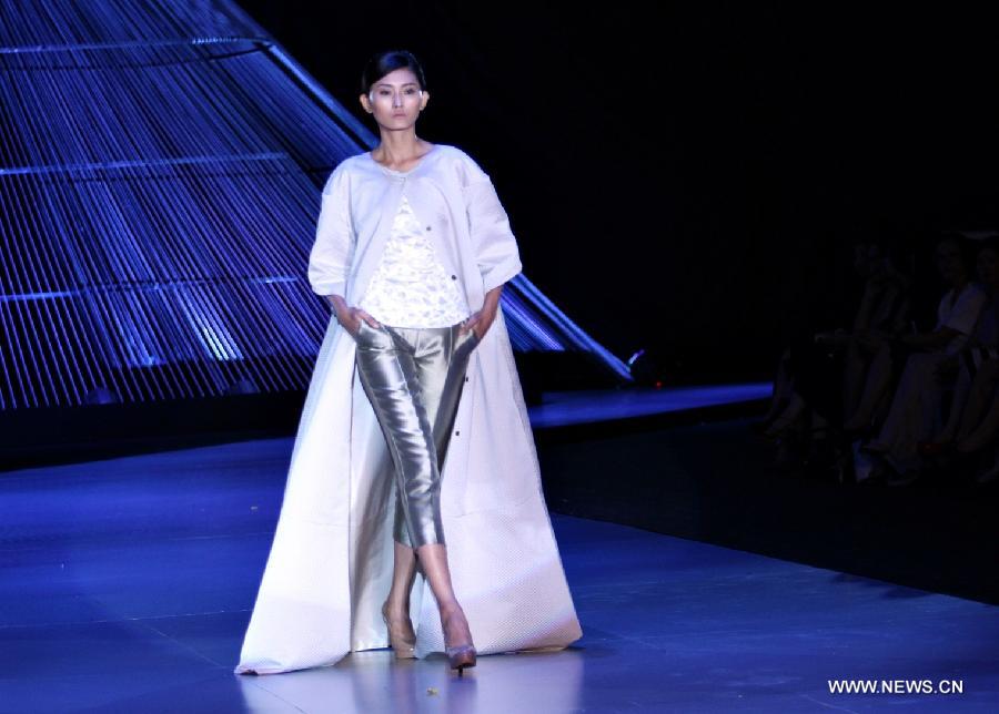 A model presents a creation of Italian designer Antonio Grimandi during the Vietnam International Fashion Week 2014 in Ho Chi Minh city, Vietnam, Dec. 4, 2014. 