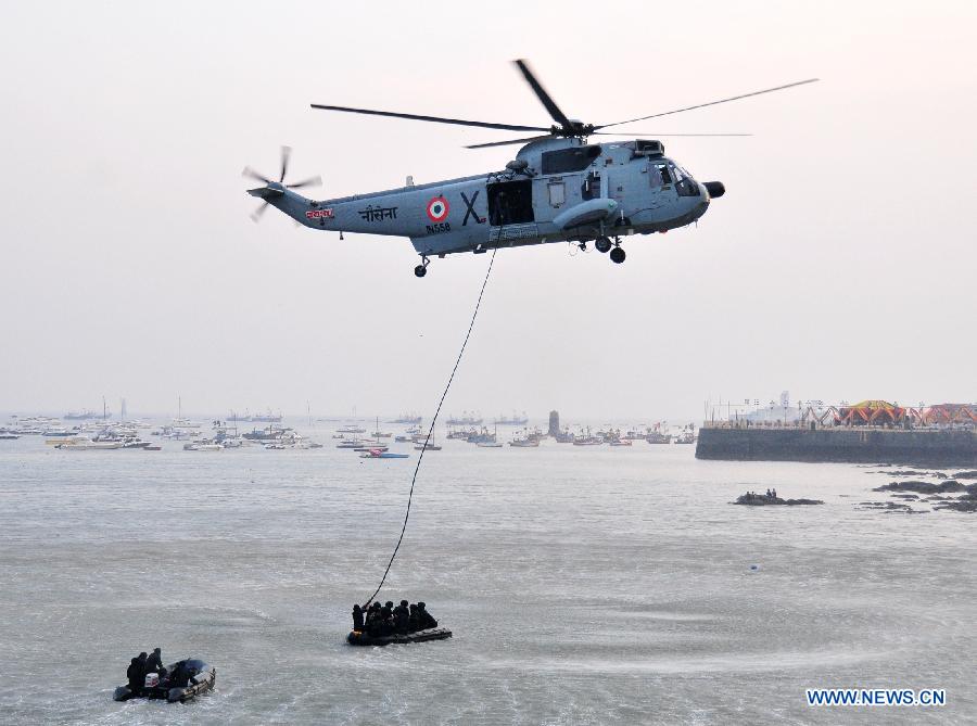 Indian Navy soldiers perform on the Navy Day celebration in Mumbai, India, Dec. 4, 2014. 