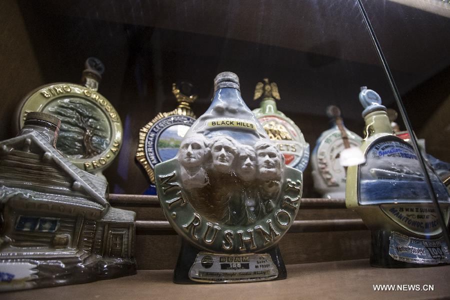 Visitors participate in a whisky catering in the Museum of Whisky in Buenos Aires, capital of Argentina, on Dec. 4, 2014.