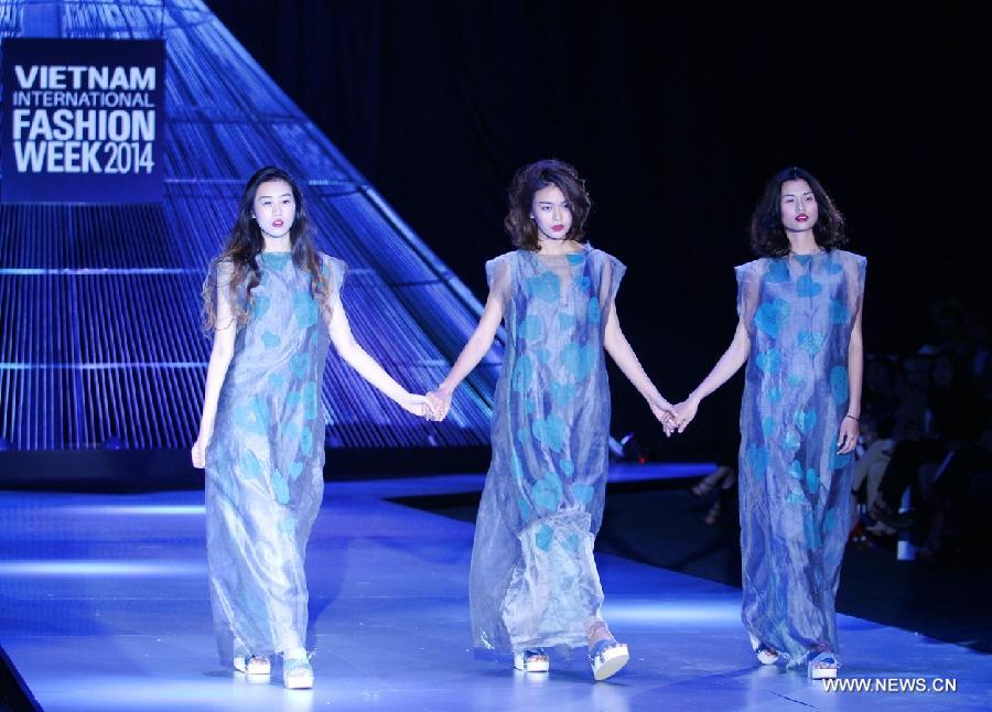 Models present creations of Vietnamese designer Li Lam during the Vietnam International Fashion Week 2014 in Ho Chi Minh city, Vietnam, Dec. 4, 2014.