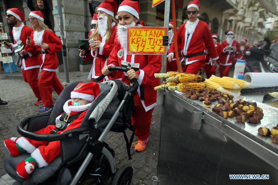 Runners wearing Santa Claus suits attend the first 'Santa Run' race in Athens, capital of Greece, Dec. 7, 2014. 