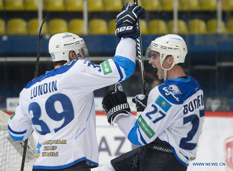 Players of Barys Astana celebrate during a match against Medvescak Zagreb at Kontinental Hockey League (KHL) in Zagreb, capital of Croatia, Dec. 8, 2014. Barys Astana won 5-3. (Xinhua/Miso Lisanin) 