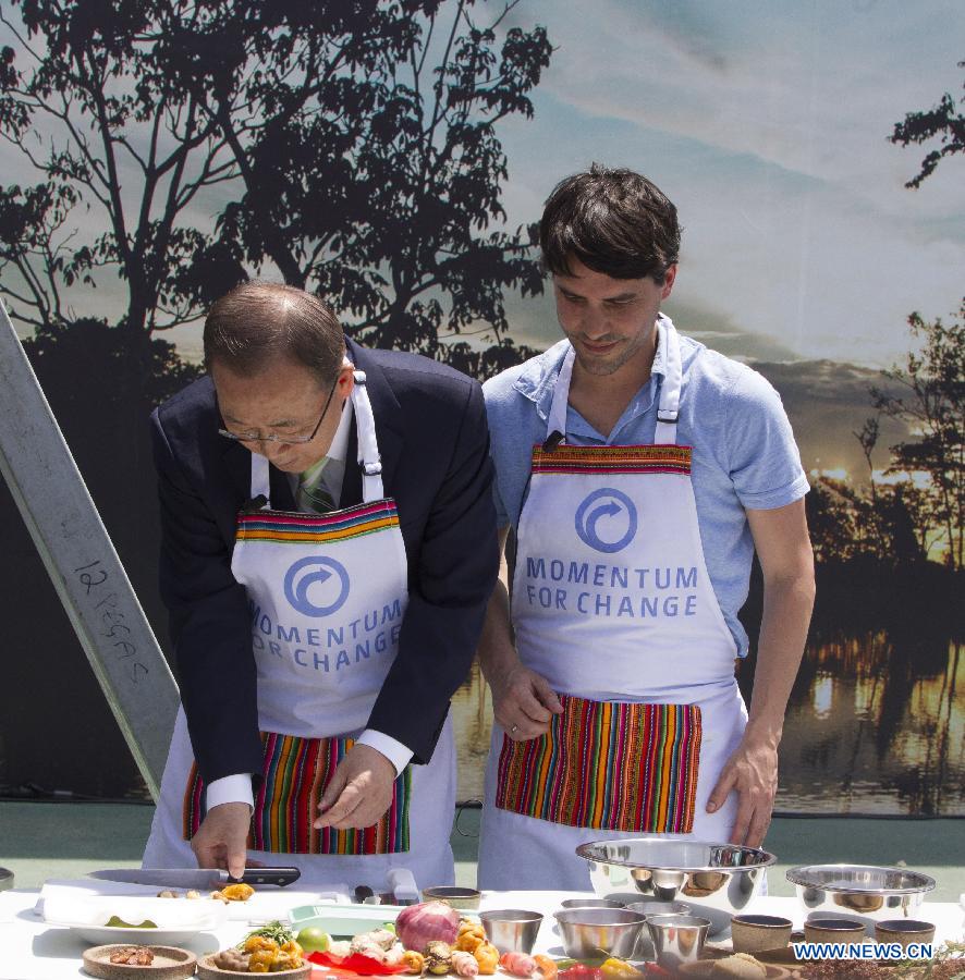 UN Secretary General Ban Ki-moon (L) learns to make 'ceviche', a Peruvian emblematic typical food from Peruvian cook Virgilio Martinez, during the 20th Conference of the United Nations on Climate Change (COP20), in Lima, capital of Peru, Dec. 10, 2014.