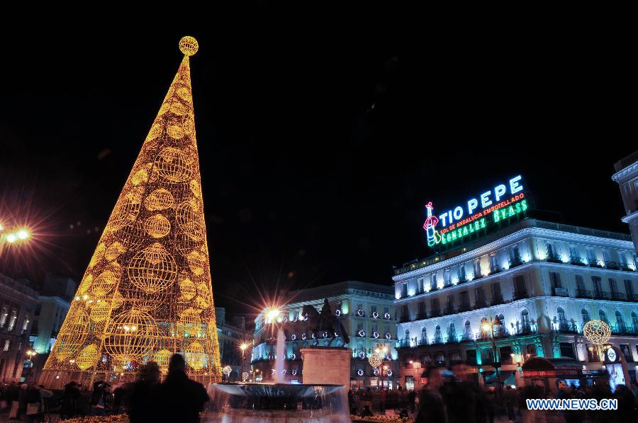 Famous landmark Puerta del Sol square is illuminated with lights for Christmas in Madrid, Spain on Dec. 11, 2014.