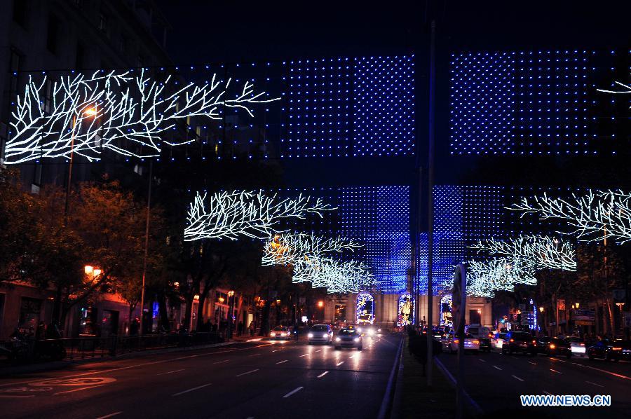 A street is illuminated with lights for Christmas in Madrid, Spain on Dec. 