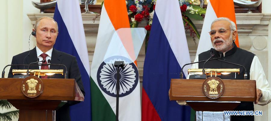 Russian President Vladimir Putin (L) and Indian Prime Minister Narendra Modi hold a joint press conference in New Delhi Dec. 11, 2014.