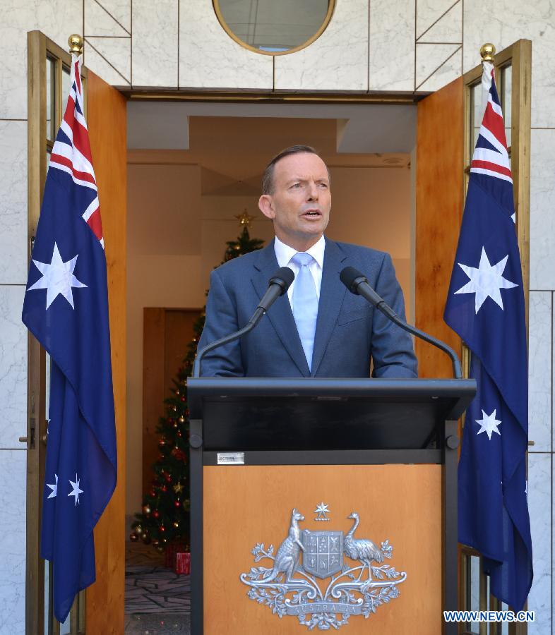 Australian Prime Minister Tony Abbott delivers a short speech at a press conference in the Parliament House hours after a few gunmen took people hostage in a cafe in Sydney CBD, in Canberra, Australia, Dec. 15, 2014. 