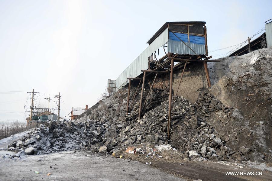 Photo taken on Dec. 15, 2014 shows the site of gas explosion at the Xingyun Colliery in Jixi City, northeast China's Heilongjiang Province. Ten people trapped underground after the gas explosion at Xingyun Colliery have died, according to a statement from the provincial production safety supervision and administration bureau. The explosion occurred at 10:10 a.m. on Sunday. The cause of the accident is being investigated. (Xinhua/Wang Kai)