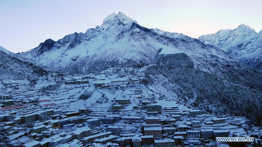 Photo taken on Dec. 16, 2014 shows the view of Namche Bazar after the snowfall in Solukhumbu, Nepal. 