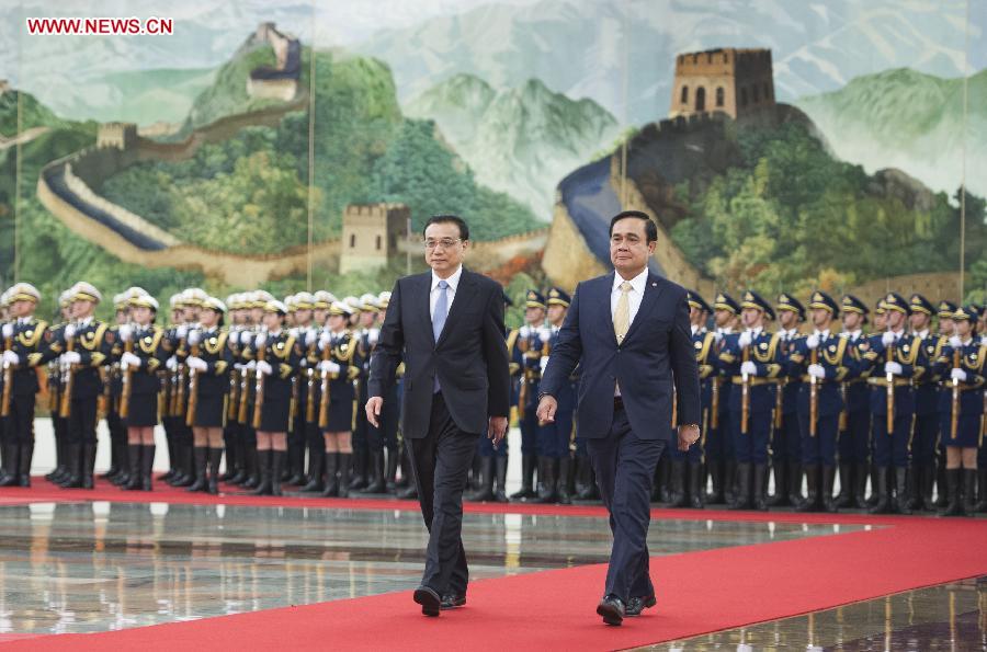 Chinese Premier Li Keqiang (R) shakes hands with visiting Thai Prime Minister Prayuth Chan-ocha before their talks in Beijing, capital of China, Dec. 22, 2014. 
