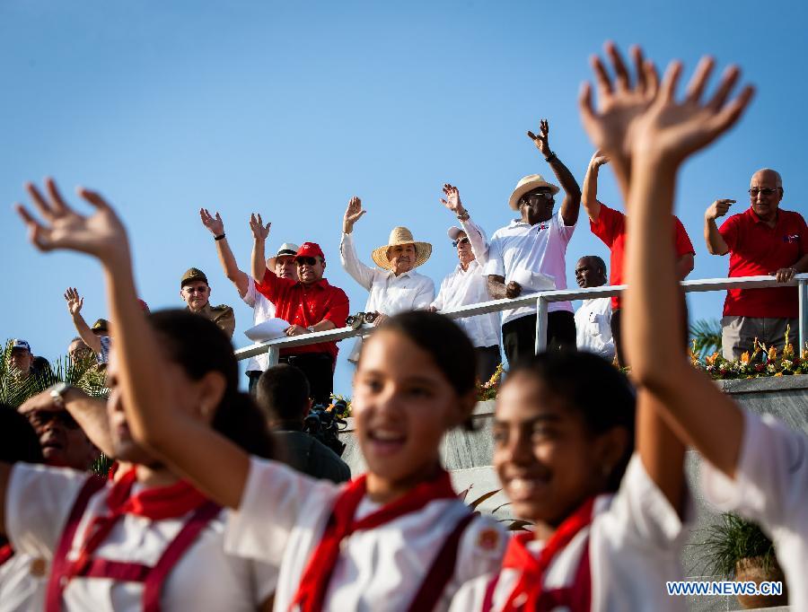 Cuban leader Raul Castro (C Rear) attends the May Day parade organized by the Cuban Workers Union at the Revolution Square in Havana, capital of Cuba, May 1, 2014.