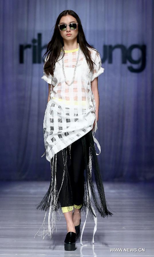 A model presents a creation by Hong Kong designer Rib Yeung at a fashion show during the China-ASEAN fashion week in Nanning, capital of southwest China's Guangxi Zhuang Autonomous Region, Jan. 3, 2015