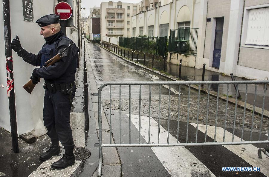 Police walk into a metro station in Paris, France, Jan. 8, 2015. Paris is beefing up security in precaution after Wednesday's deadly terrorist which left 12 people killed and 11 others injured.