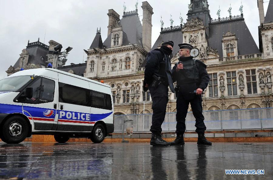 Police walk into a metro station in Paris, France, Jan. 8, 2015. Paris is beefing up security in precaution after Wednesday's deadly terrorist which left 12 people killed and 11 others injured.