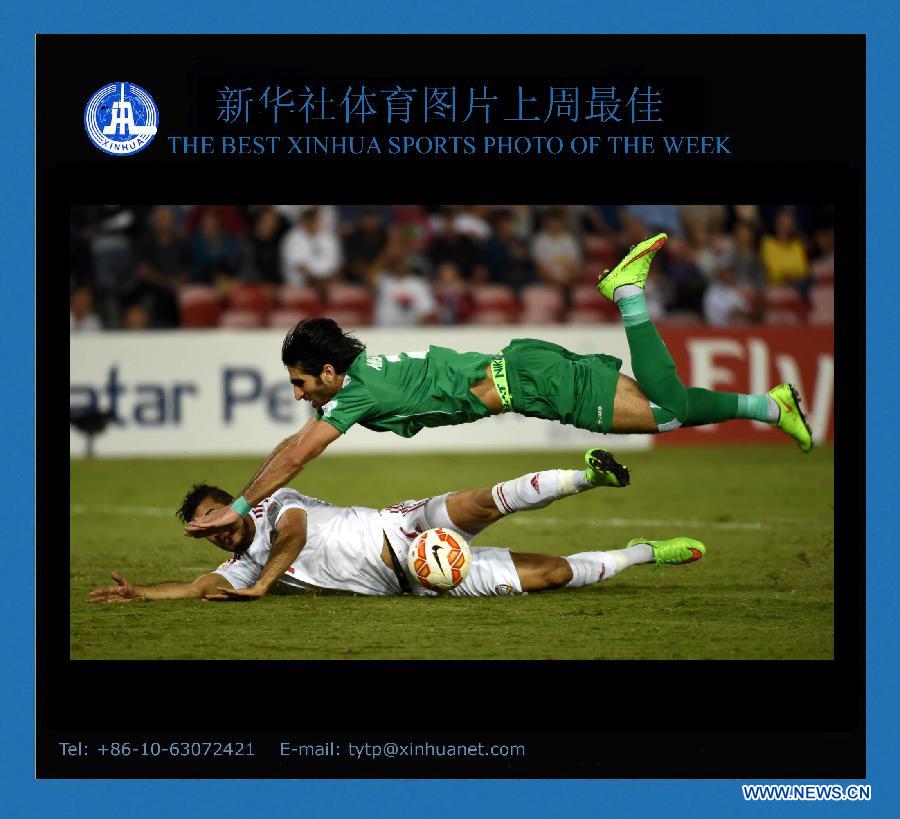 Ahmed Ibrahim (top) of Iraq fouls against Ali Ahmed Mabkhout of the United Arab Emirates during the third and fourth final match at the 2015 AFC Asian Cup in Newcastle, Australia, Jan. 30, 2015. 