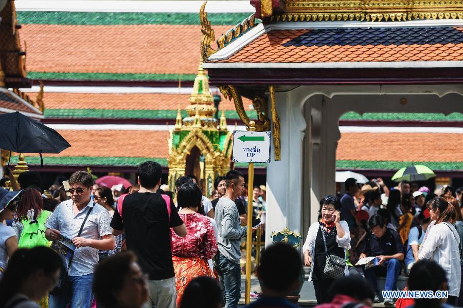 Some Chinese tourists visit the Grand Palace in Bangkok, capital of Thailand, on Feb. 15, 2015.