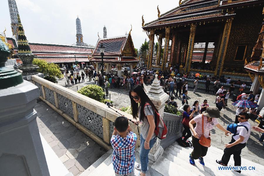 Some Chinese tourists visit the Grand Palace in Bangkok, capital of Thailand, on Feb. 15, 2015.