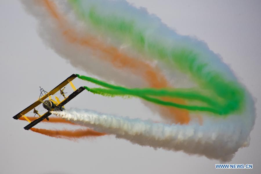 Catwalk or Skycats of the Scandinavian Aerobatic Team leave a trail of Indian tri-colour smoke as they perform aerobatics on the second day of the Aero India 2015 in Air Force Station Yelahanka of Bengaluru, Karnataka of India, Feb. 19, 2015. The biennial air show this year attracted dealers from 49 countries such as US, Russia, France, Israel, UK and so on.