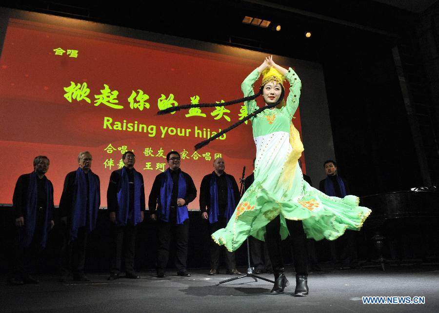 A dancer performs during the Chinese Spring Festival soiree, organized by Chinese students in Brussels, Belgium, Feb. 25, 2015. 