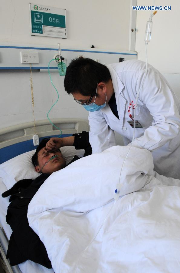 An injured man receives treatment after a road accident at a hospital in Linzhou City, central China's Henan Province, March 3, 2015. Twenty people have been confirmed dead and 13 others were injured after a coach fell off a cliff late Monday night in Linzhou City. The bus was carrying members of a local opera troupe when the accident occurred in Linzhou, under the jurisdiction of Anyang City, according to the municipal government of Anyang. (Xinhua/Zhu Xiang) 