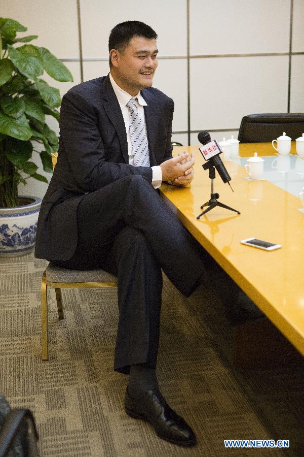 Yao Ming, former NBA star and a member of the 12th National Committee of the Chinese People's Political Consultative Conference (CPPCC), receives an exclusive interview with Xinhua News Agency and answers questions concerning his proposal on promoting physical education of specific sports in Beijing, capital of China, March 3, 2015.