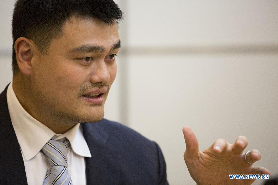 Yao Ming, former NBA star and a member of the 12th National Committee of the Chinese People's Political Consultative Conference (CPPCC), receives an exclusive interview with Xinhua News Agency and answers questions concerning his proposal on promoting physical education of specific sports in Beijing, capital of China, March 3, 2015. 