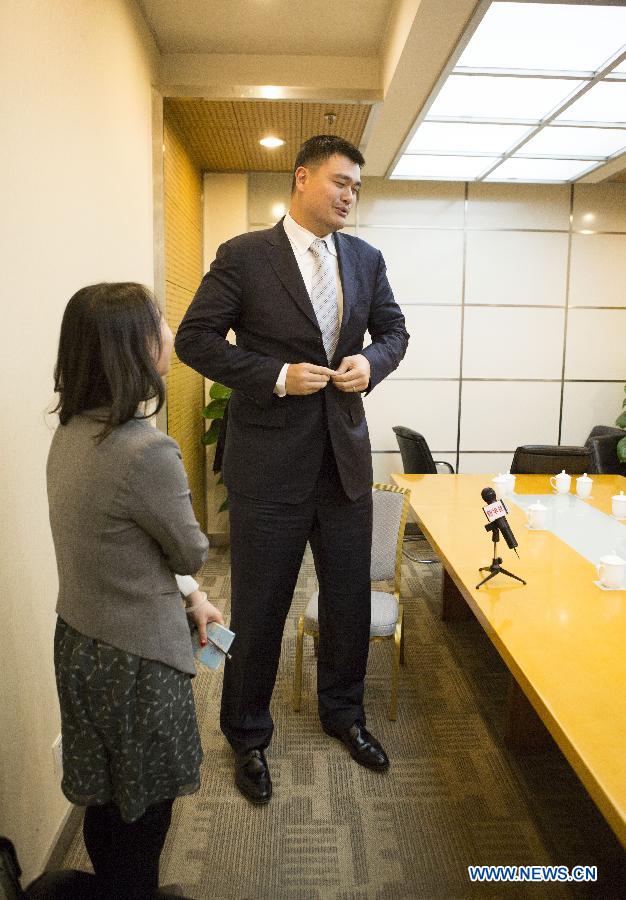 Yao Ming, former NBA star and a member of the 12th National Committee of the Chinese People's Political Consultative Conference (CPPCC), receives an exclusive interview with Xinhua News Agency and answers questions concerning his proposal on promoting physical education of specific sports in Beijing, capital of China, March 3, 2015.