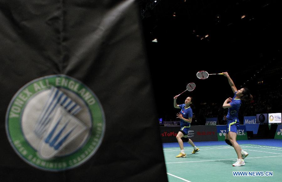 Tian Qing (R) and Zhao Yunlei of China compete during the women's doubles first round match between Tian Qing/Zhao Yunlei of China and Lee So Hee/Shin Seung Chan of Korea at the All England Open Badminton Championships at Barclaycard Arena in Birmingham, Britain on March 4, 2015. 